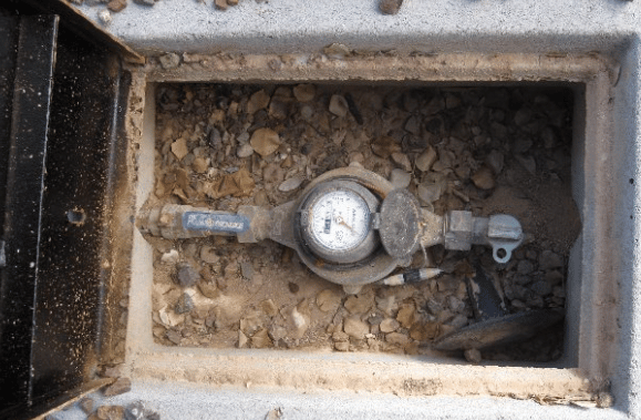 A Water Meter Is Sitting In A Hole In The Ground — Tweed Heads Leak Detection in Casuarina, NSW
