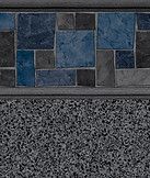 Blue and gray tiled wall above a speckled gray surface