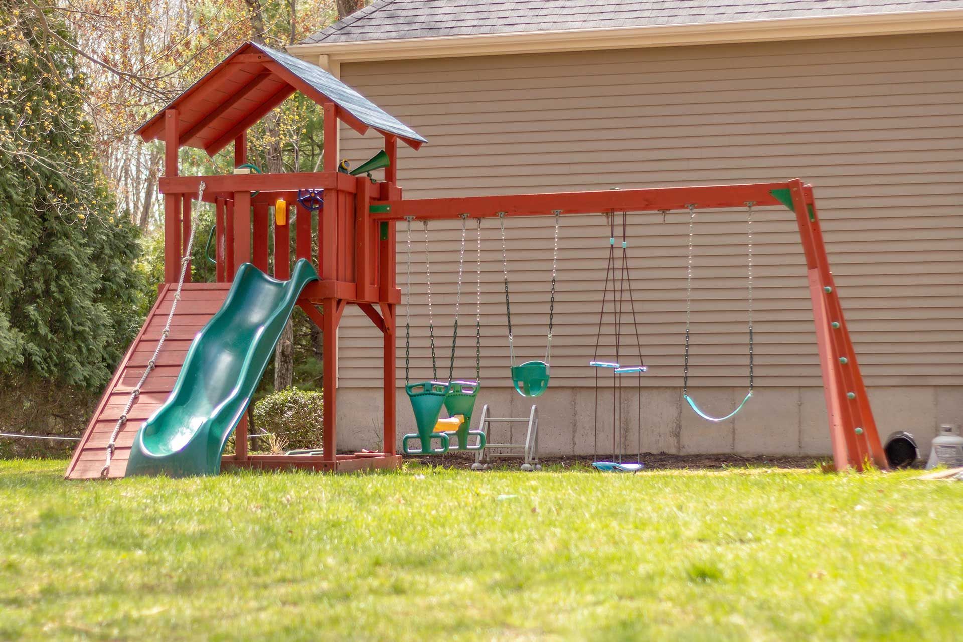 swingset or playground in a home backyard

