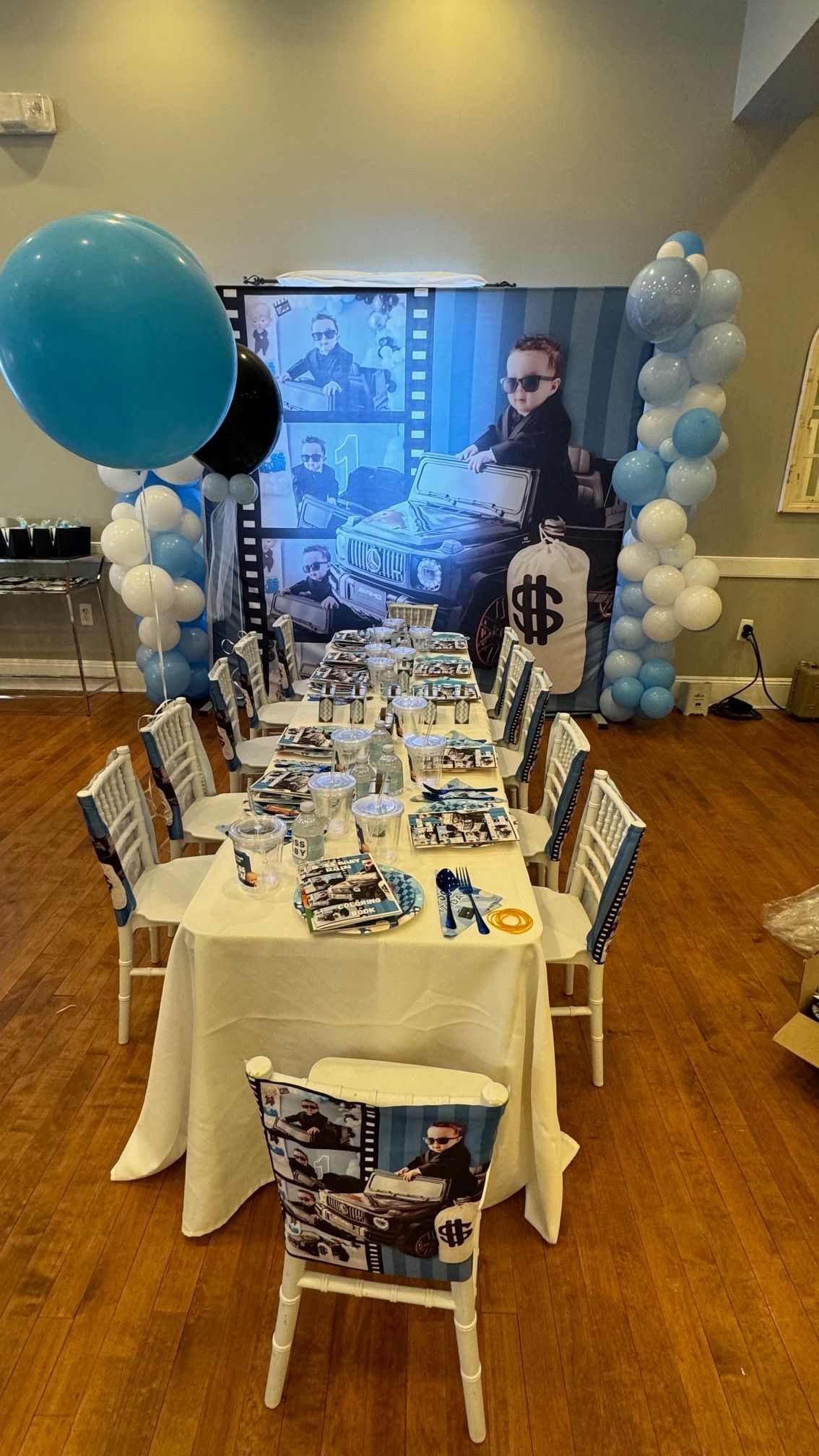A table and chairs are set up for a birthday party.