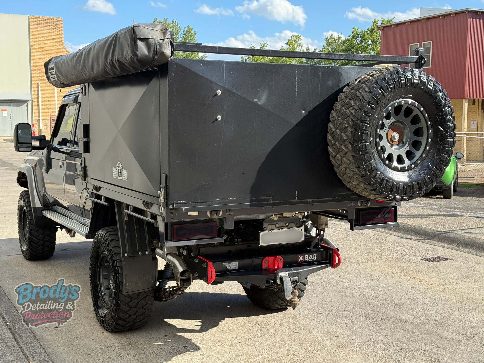 Dark Grey Toyota Land Cruiser Parked in Front of a Building — Brody’s Car Detailing In Tamworth, NSW