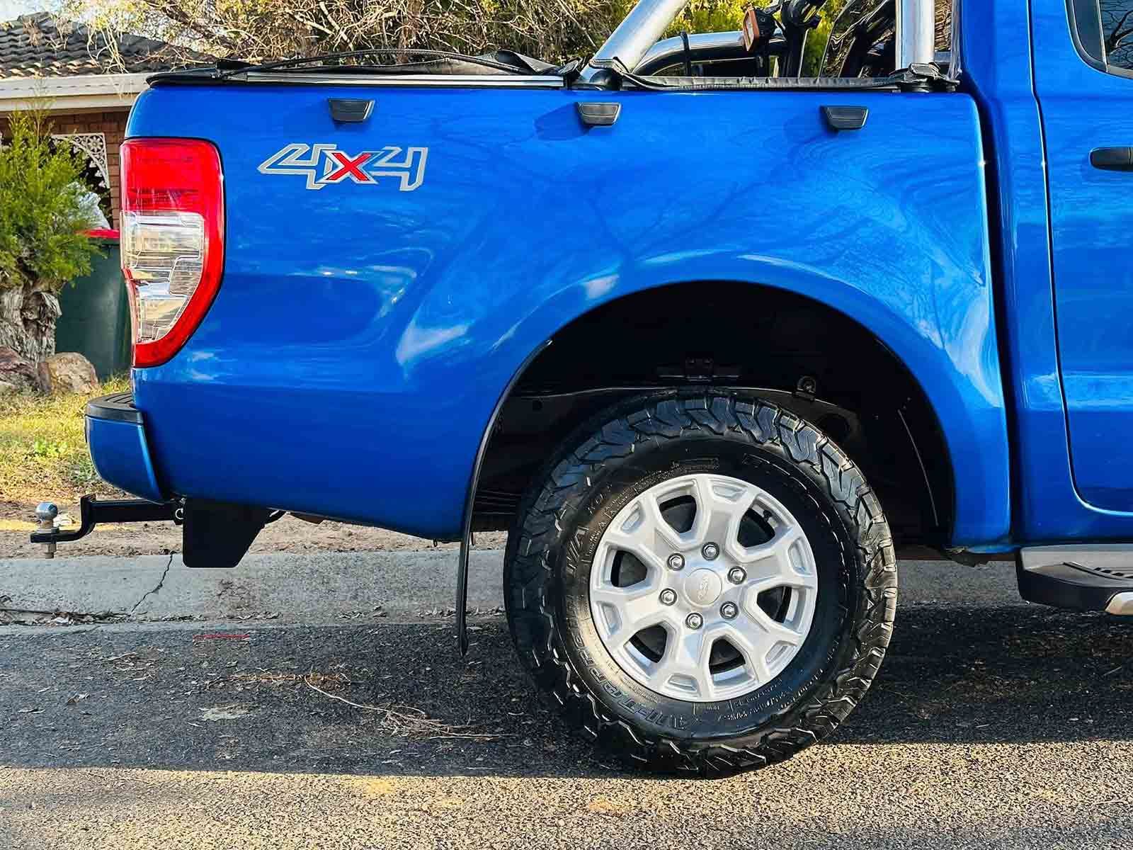 A Blue 4x4 Truck Is Parked On The Side Of The Road — Brody’s Car Detailing In Tamworth, NSW
