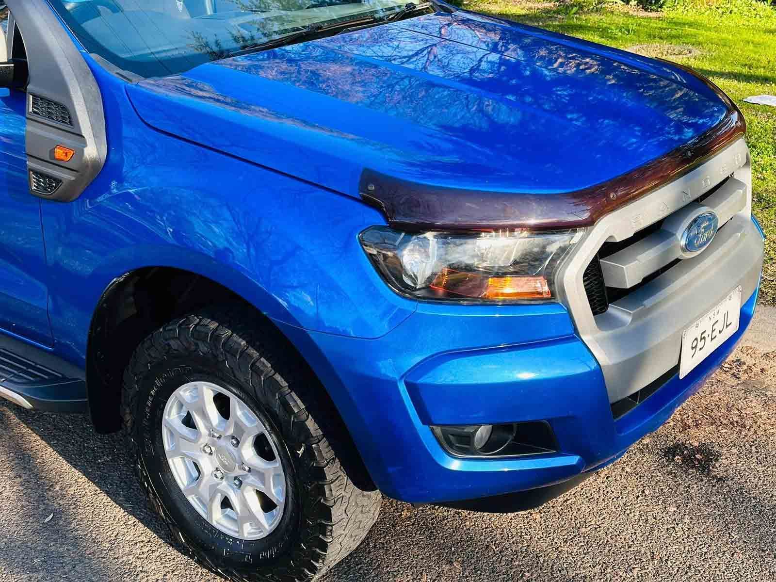 A Blue Ford Ranger Is Parked On A Gravel Road — Brody’s Car Detailing In Tamworth, NSW