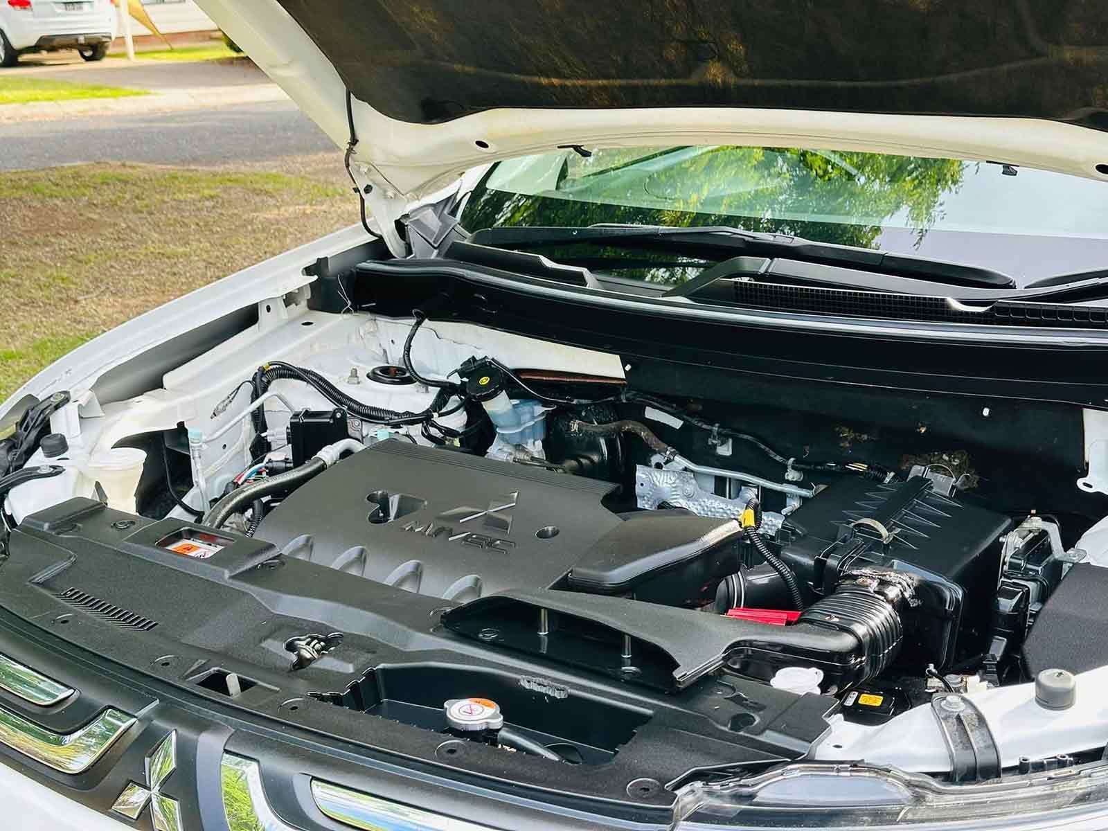 The Engine Of A Car Is Shown With The Hood Open — Brody’s Car Detailing In Tamworth, NSW