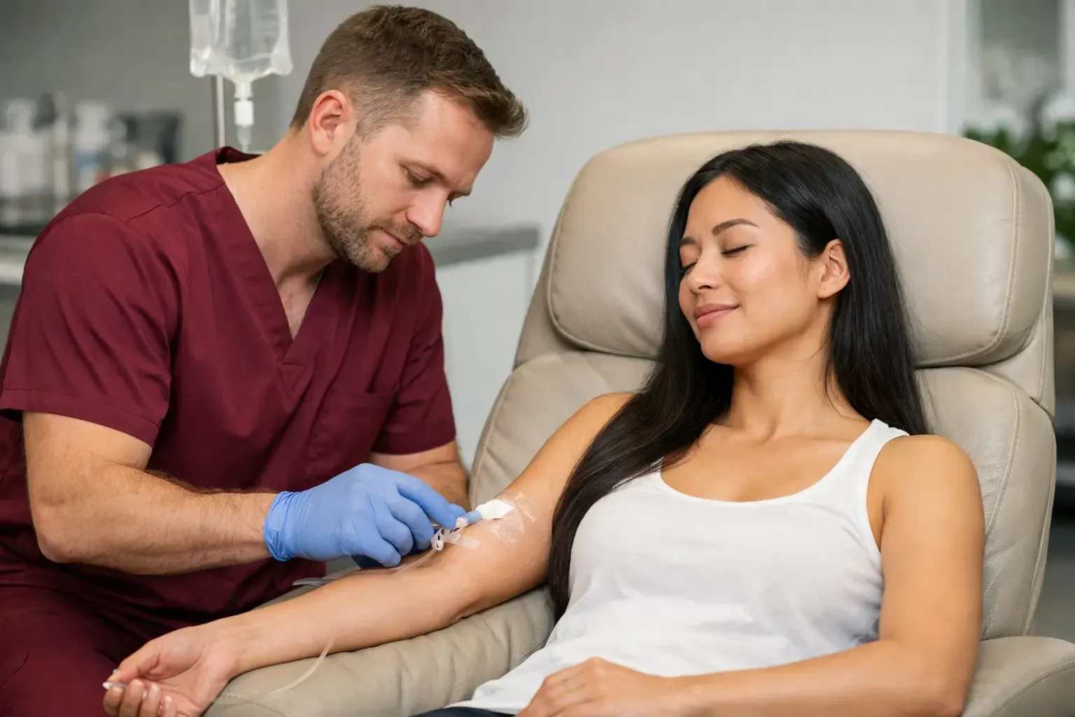 Nurse giving an injection to a seated patient in a clinic chair