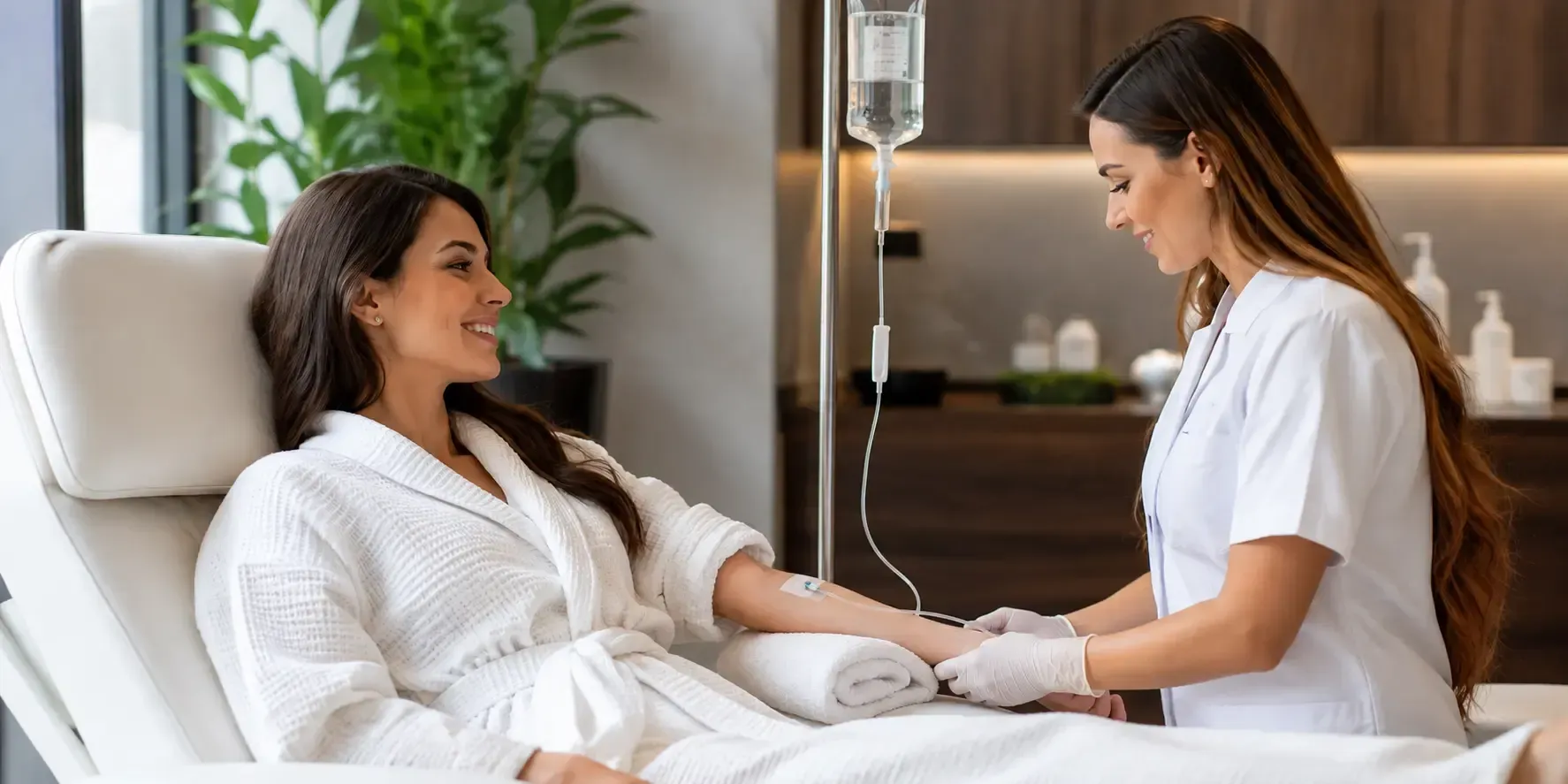 Medical professional administering a NAD+ IV therapy infusion to a relaxed patient in a comfortable spa chair, with a clear IV bag, properly connected tubing, and a clean, modern wellness clinic setting.