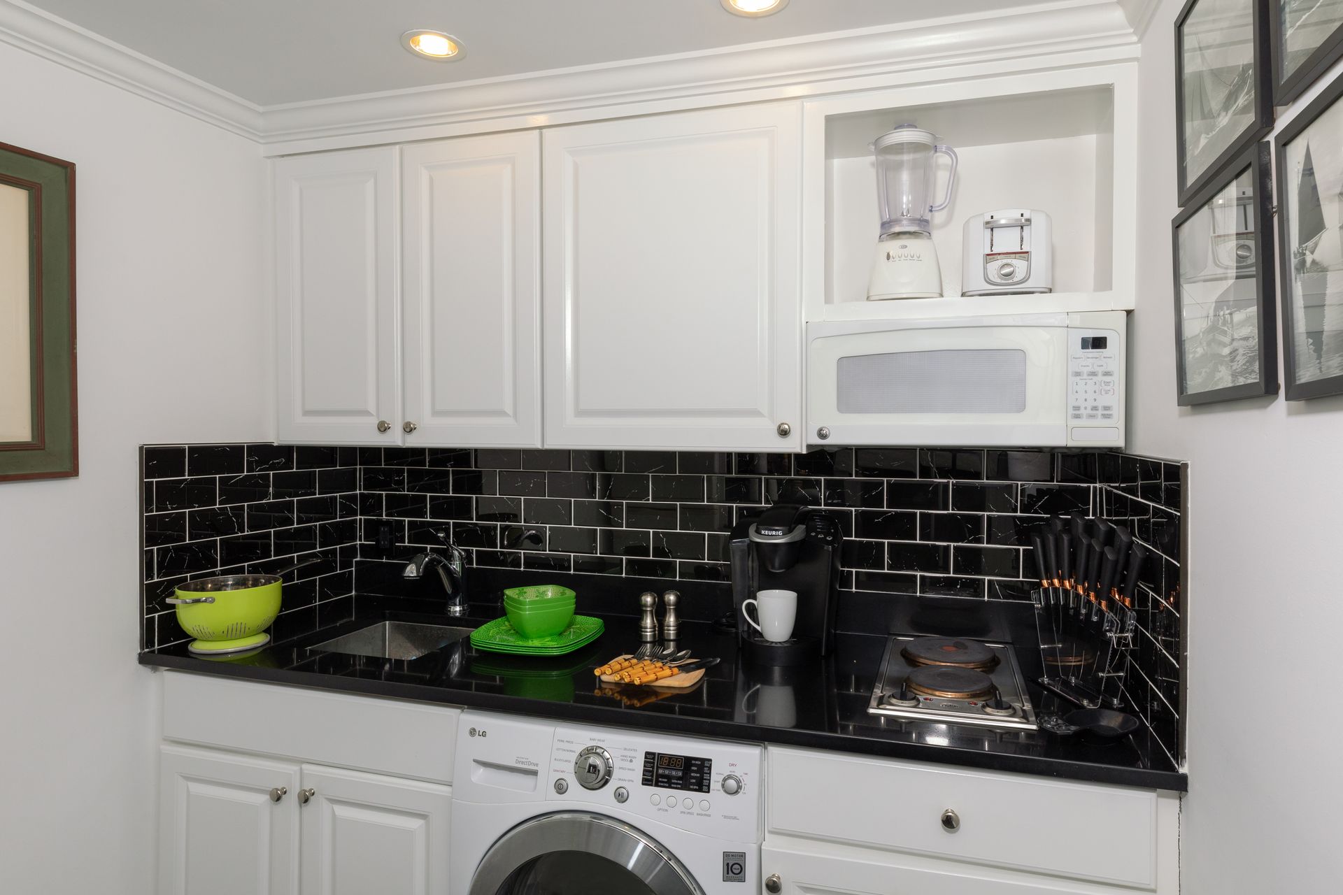 There is a washer and dryer in the kitchen.