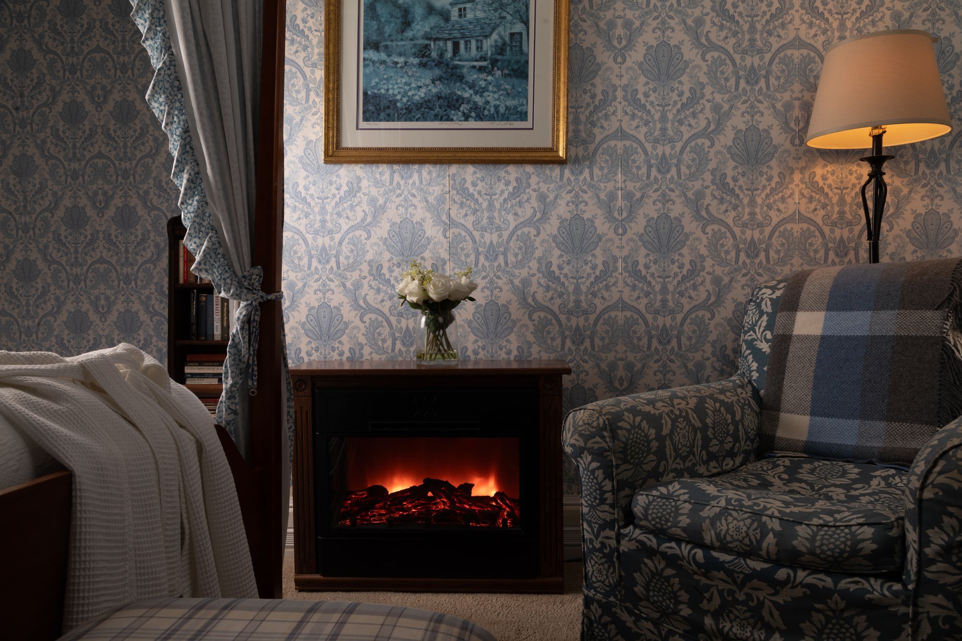 A living room with a fireplace and a chair