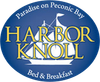 Logo for Harbor Knoll Bed & Breakfast. Blue oval with sailboat design and gold text on a blue background.
