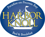 Logo for Harbor Knoll Bed & Breakfast. Blue oval with sailboat design and gold text on a blue background.