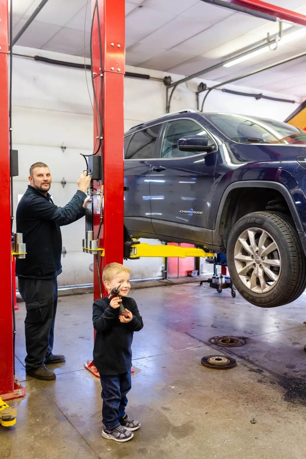 black car in garage  | Ally Auto Service