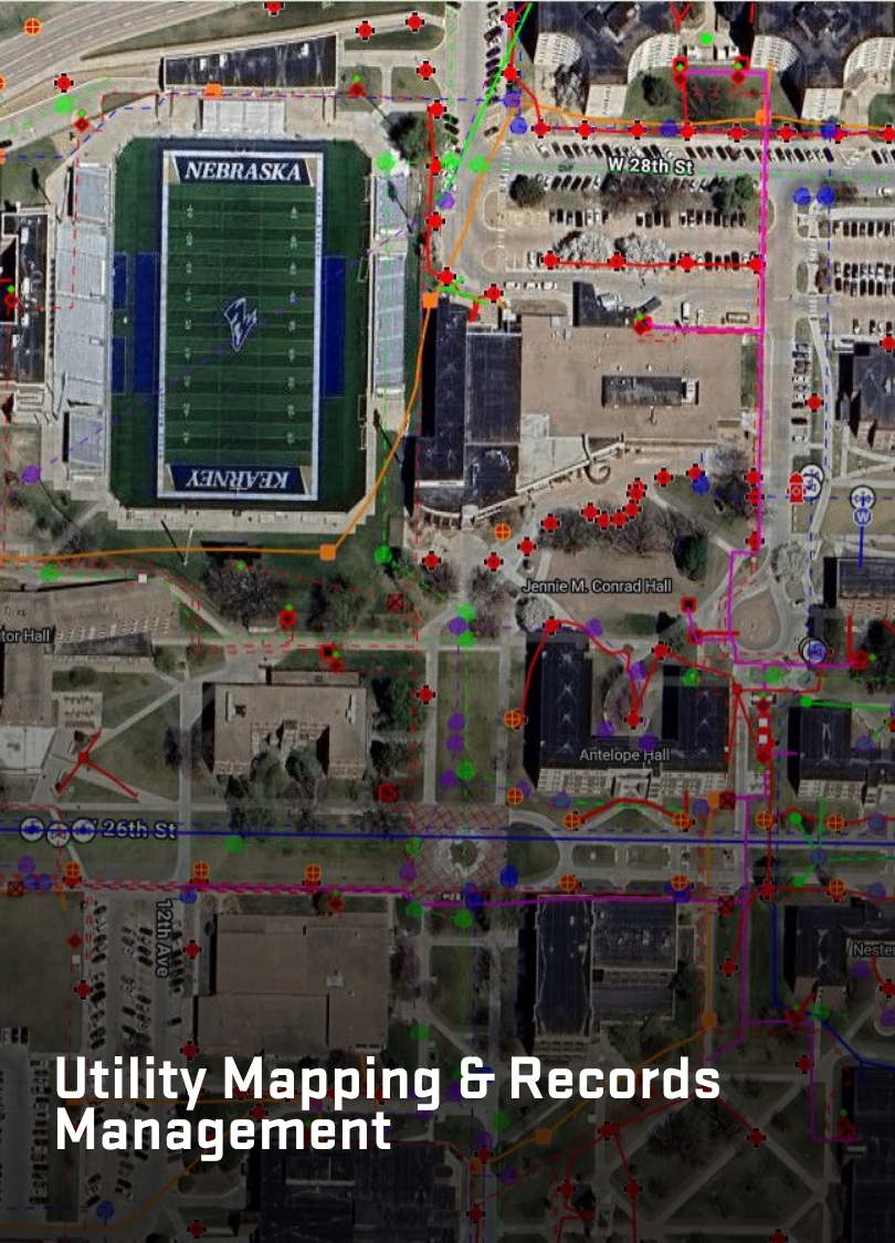 Aerial view of a campus with complex utility lines color-coded and overlaid on a map for infrastructure management.