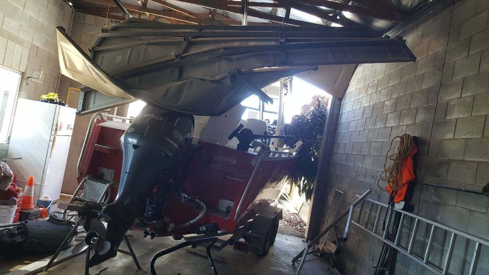 Severely Broken Garage Door — Garage Door Repairs in Marcoola QLD