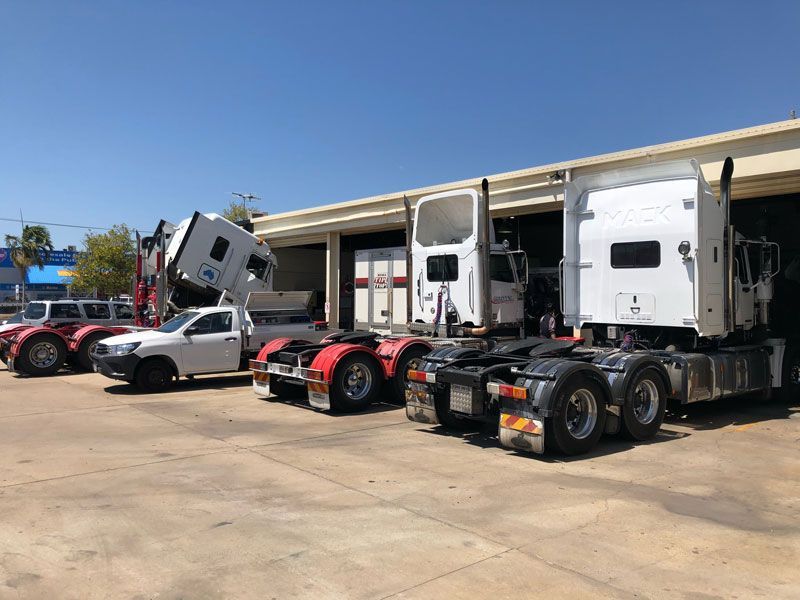 Parked Trucks — Townsville, QLD — Leslie's Auto Electrical & Air-Conditioning Parked Trucks — Townsville, QLD — Leslie's Auto Electrical & Air-Conditioning
