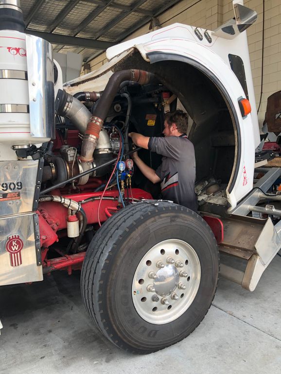 Man working on truck — Townsville, QLD — Leslie's Auto Electrical & Air-Conditioning Townsville, QLD — Leslie's Auto Electrical & Air-Conditioning