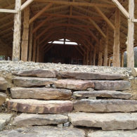 Stone steps leading up to a timber pavilion or lodge entrance