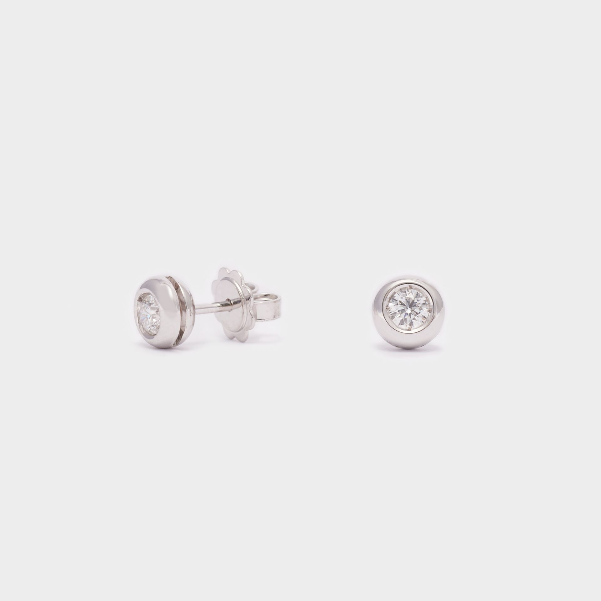 ORECCHINI  18 KT MICROFUSI  CON ZIRCONI 
CHIUSURA FARFALLINA
