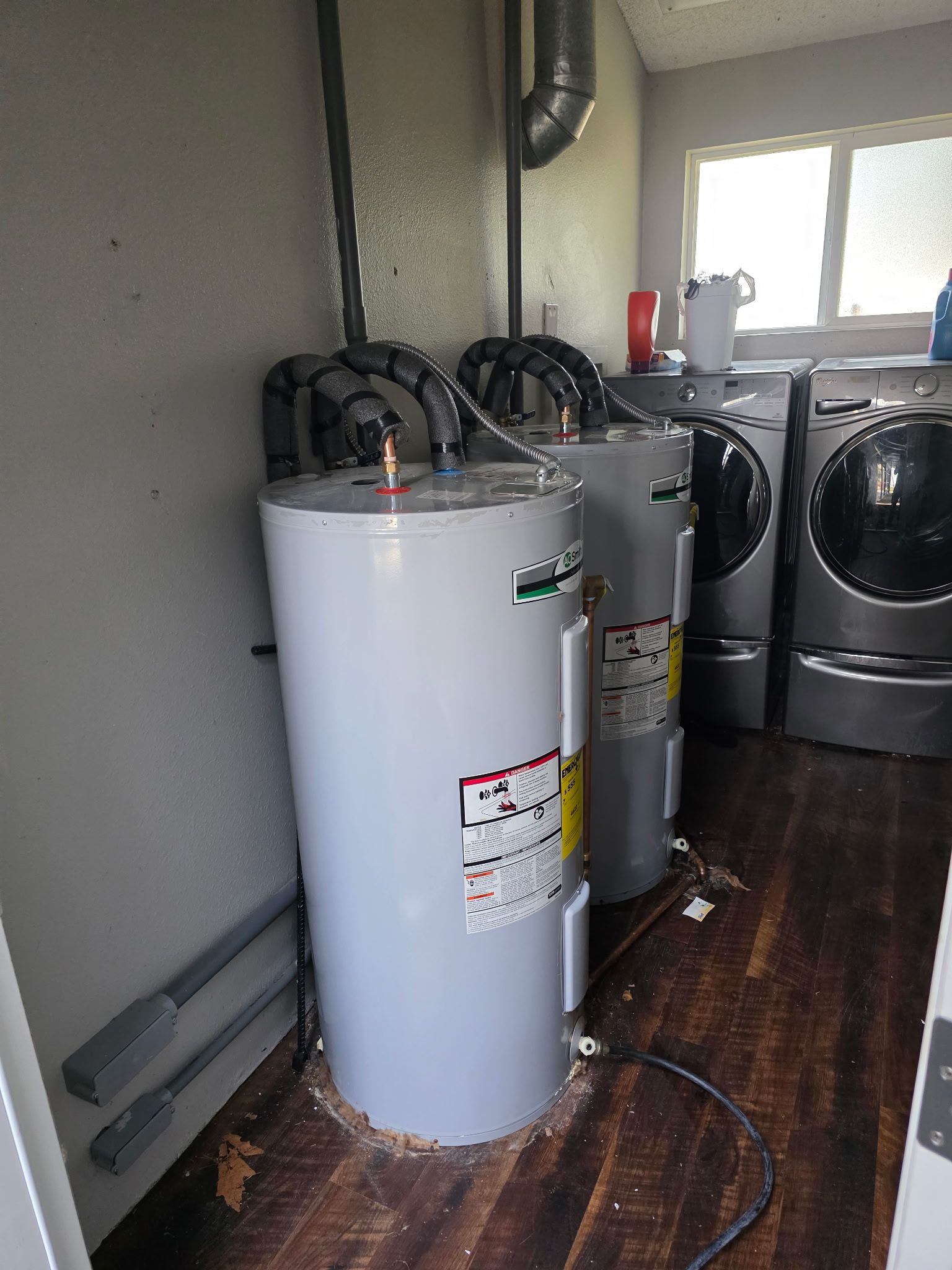 Before picture our a double water heater in a duplex that issues