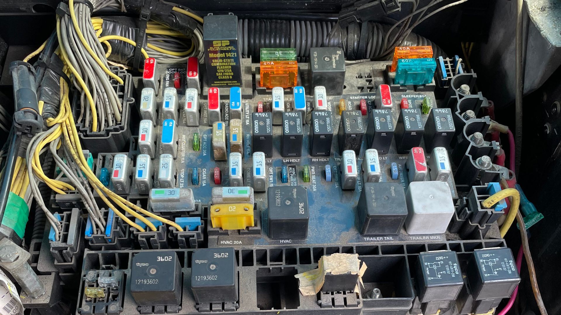 A close up of a fuse box in a car.