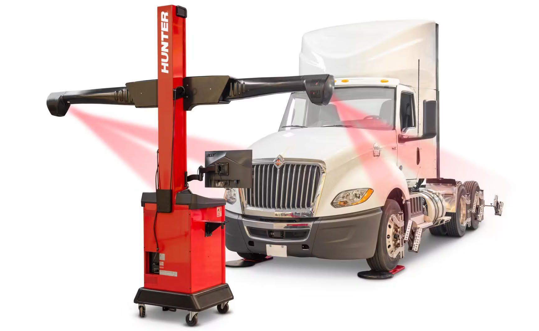 A truck is being aligned with a machine.