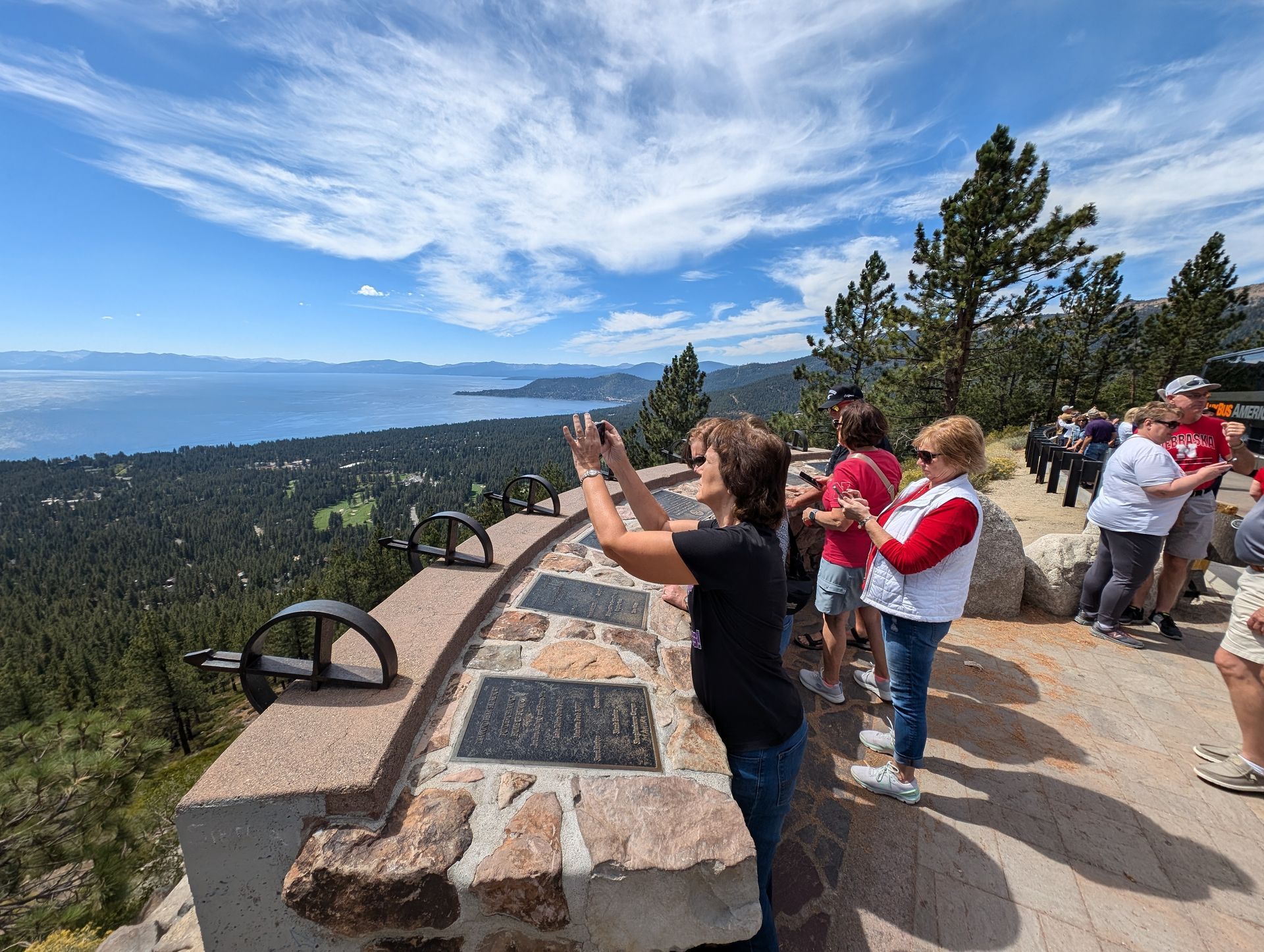 Lake Tahoe tour guests enjoying a panoramic overlook above the lake