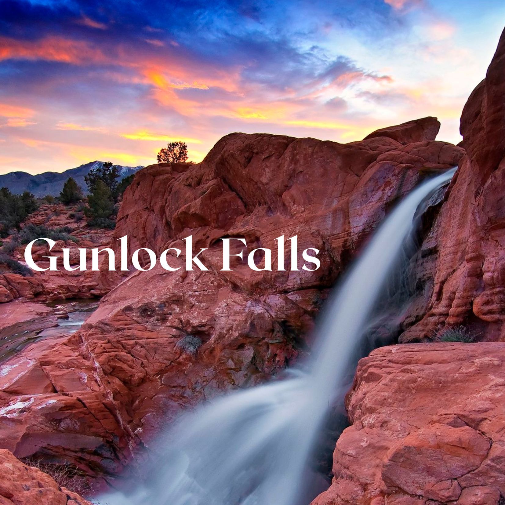 Gunlock Falls cascading over red rocks at sunset with colorful sky