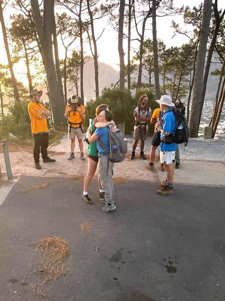 team of hiking guided geeting each other