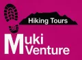 A logo for hiking tours with a mountain in the background