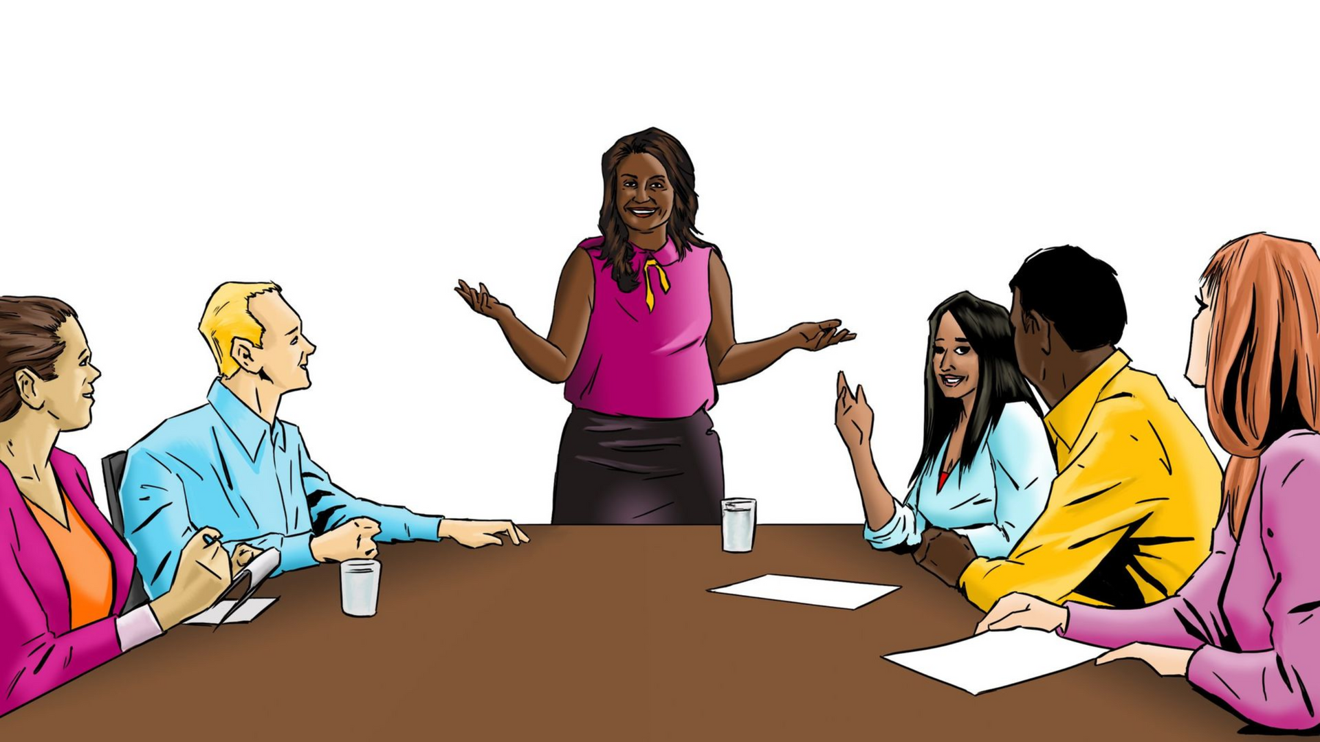 A woman in a pink top leads a meeting with six colleagues at a brown table.