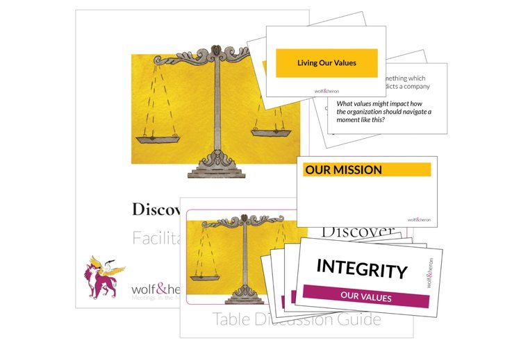 Printed materials including a scale graphic, "Our Mission," and "Integrity" cards.