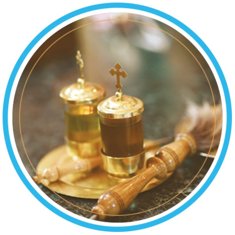 Golden church communion vessels with a wooden handle on a tray, framed by a blue circle