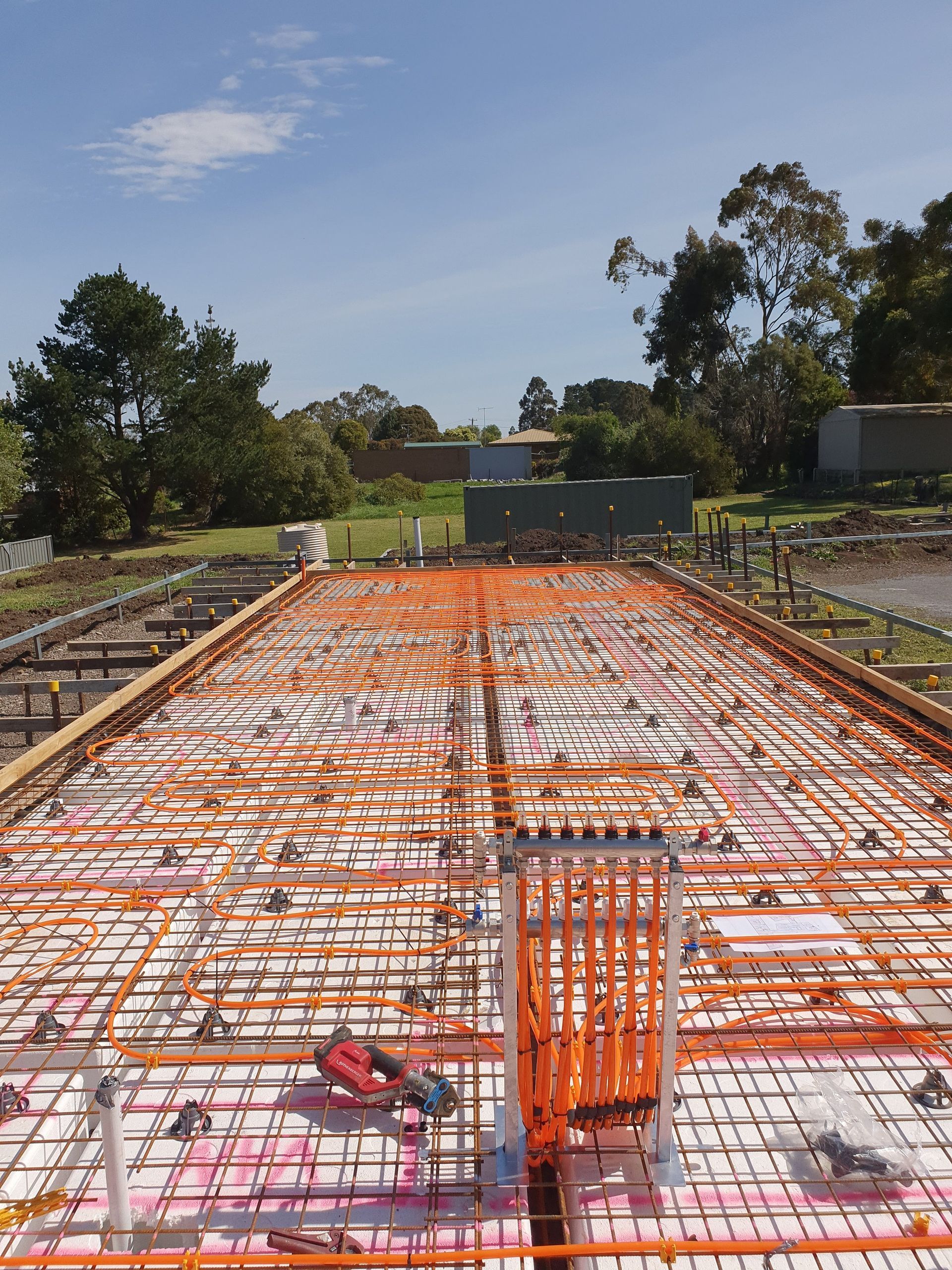 A construction site with a lot of wire laying on the ground