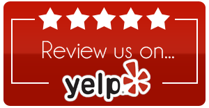 Red Yelp review sign with five stars and “Review us on...”
