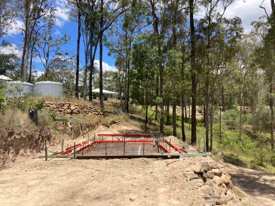 A Bridge is Being Built in the Middle of a Forest — Crete to Coast Concreting in Jimboomba, QLD