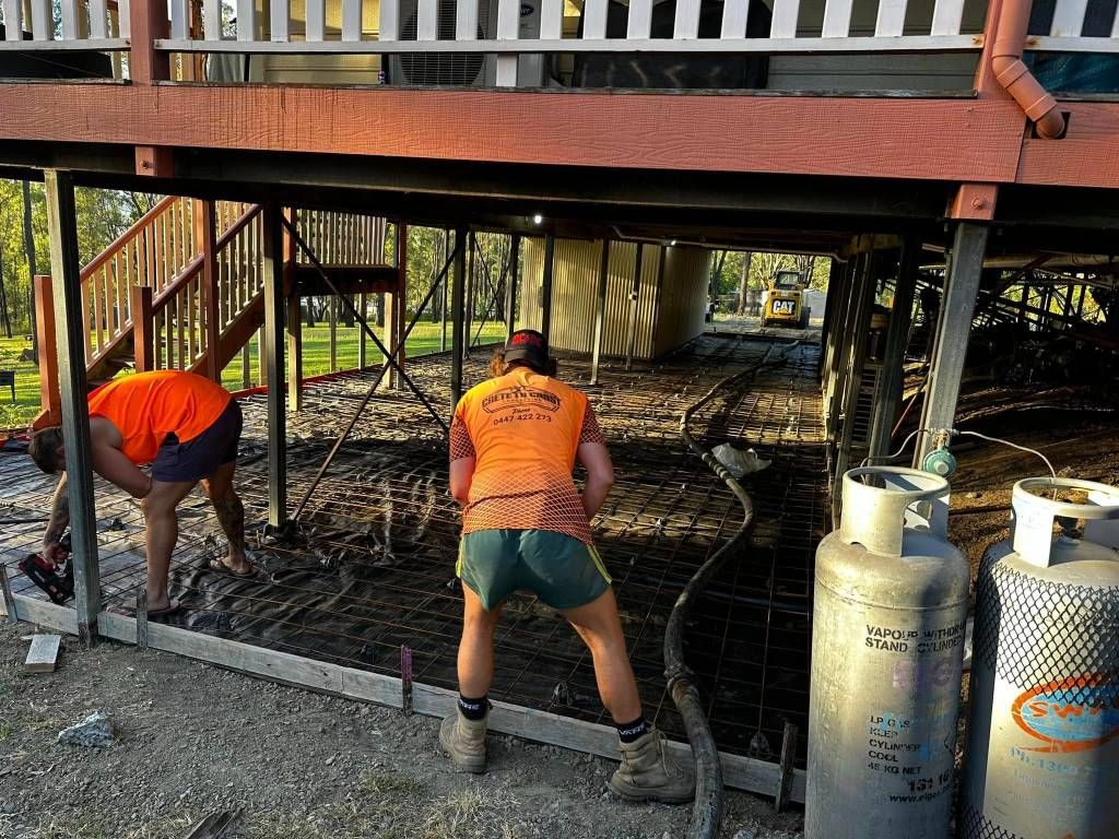 A Group of People Are Working on the Foundation of a House — Crete to Coast Concreting in Browns Plains, QLD