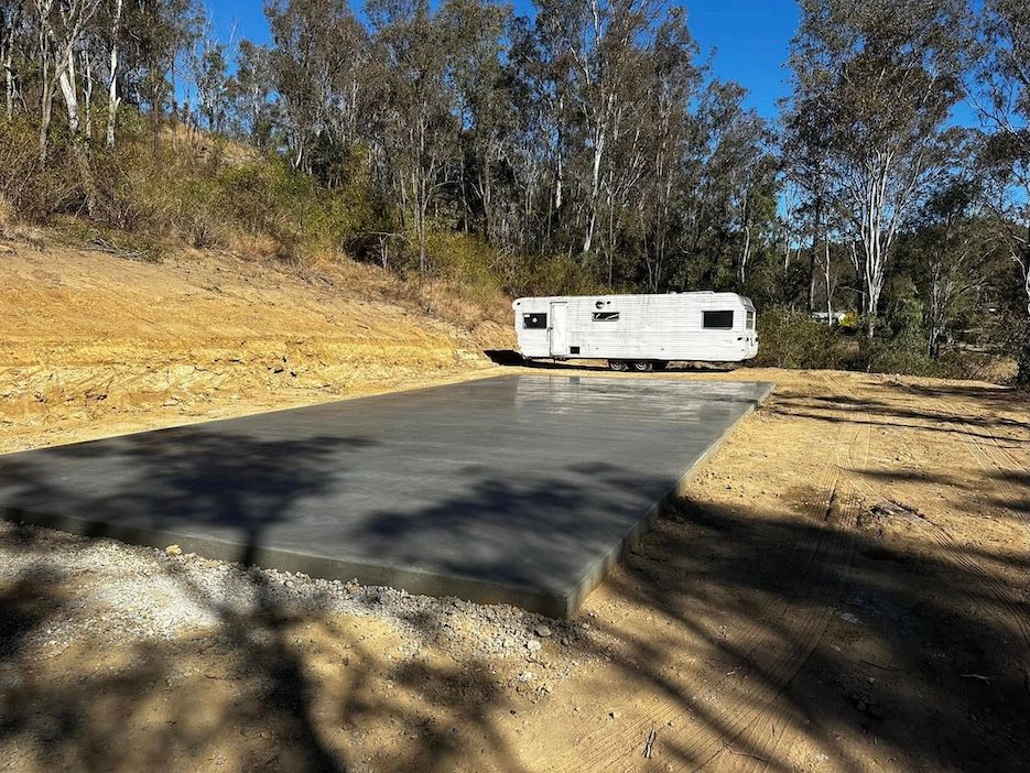 Simple House Slab With Caravan In Background — Crete to Coast Concreting in Tamborine, QLD
