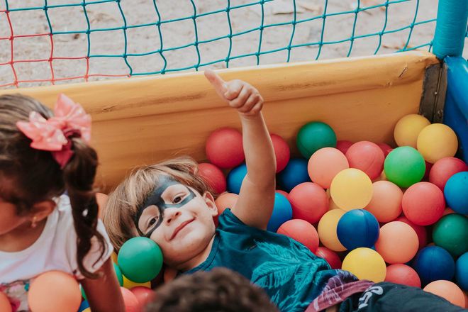 Children playing in the ball pit in the indoor play area