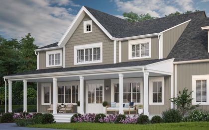 A large house with a porch and a lot of windows