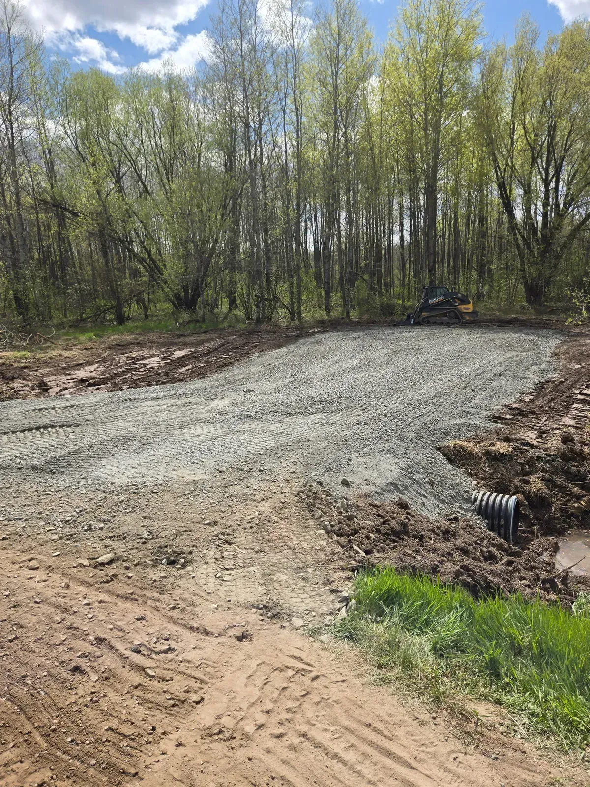 Culvert pipe end at the edge of a new gravel parking pad in Curtiss, WI – ERE Excavation