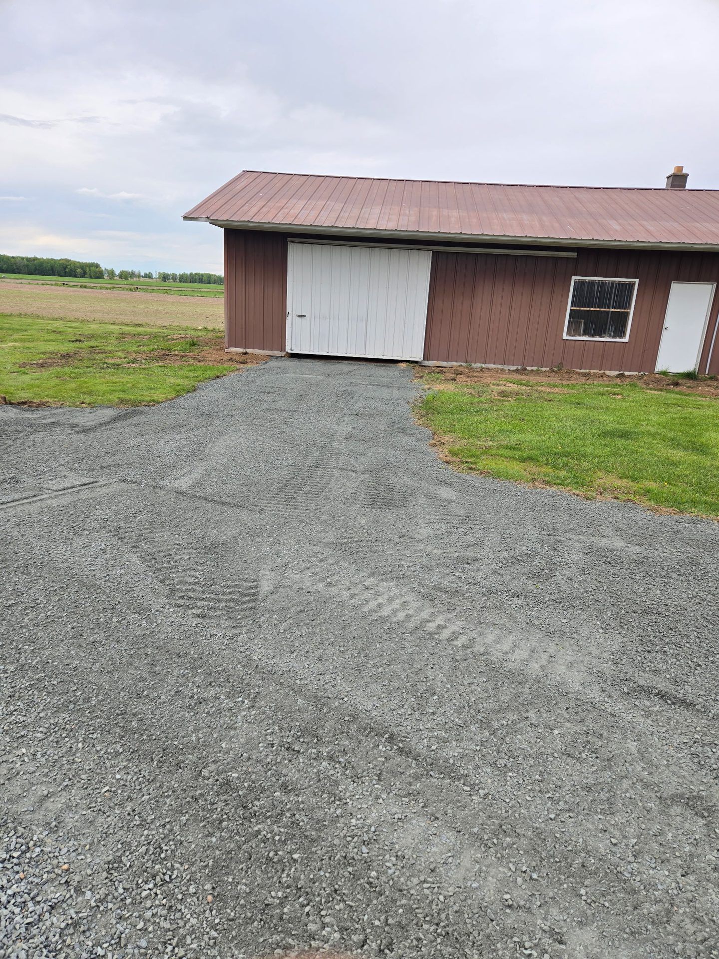 New gravel apron and approach finished in front of a pole shed in Dorchester, WI