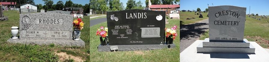 Three cemetery headstones with flowers, including gray and black markers in a row.