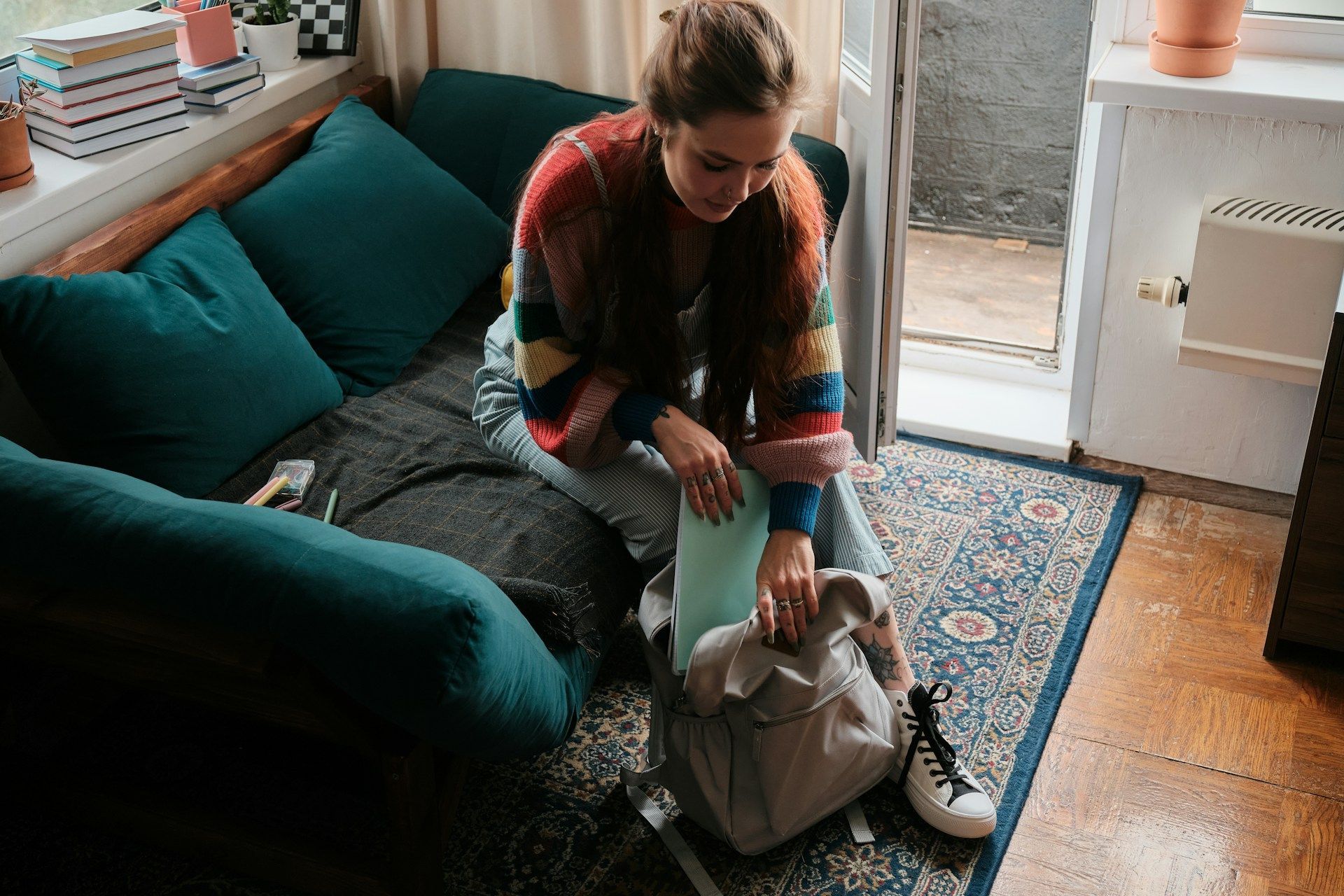 student inside her apartment