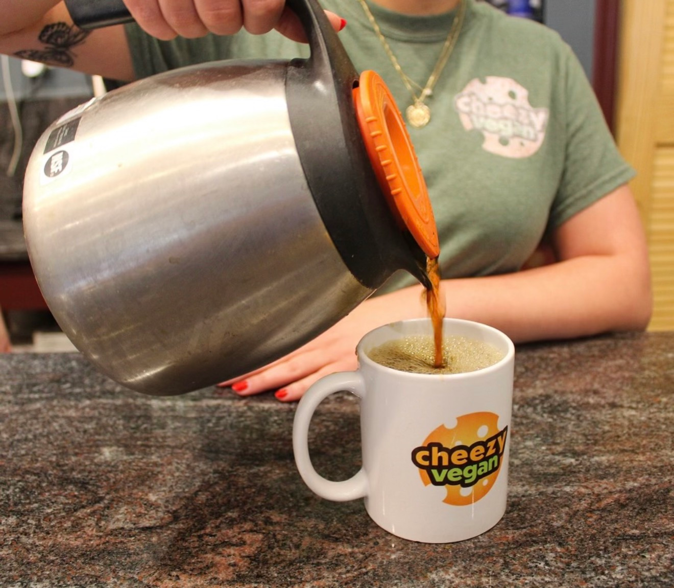 Thanksgiving plate with turkey, cranberry sauce, green beans, mashed potatoes, and gravy.