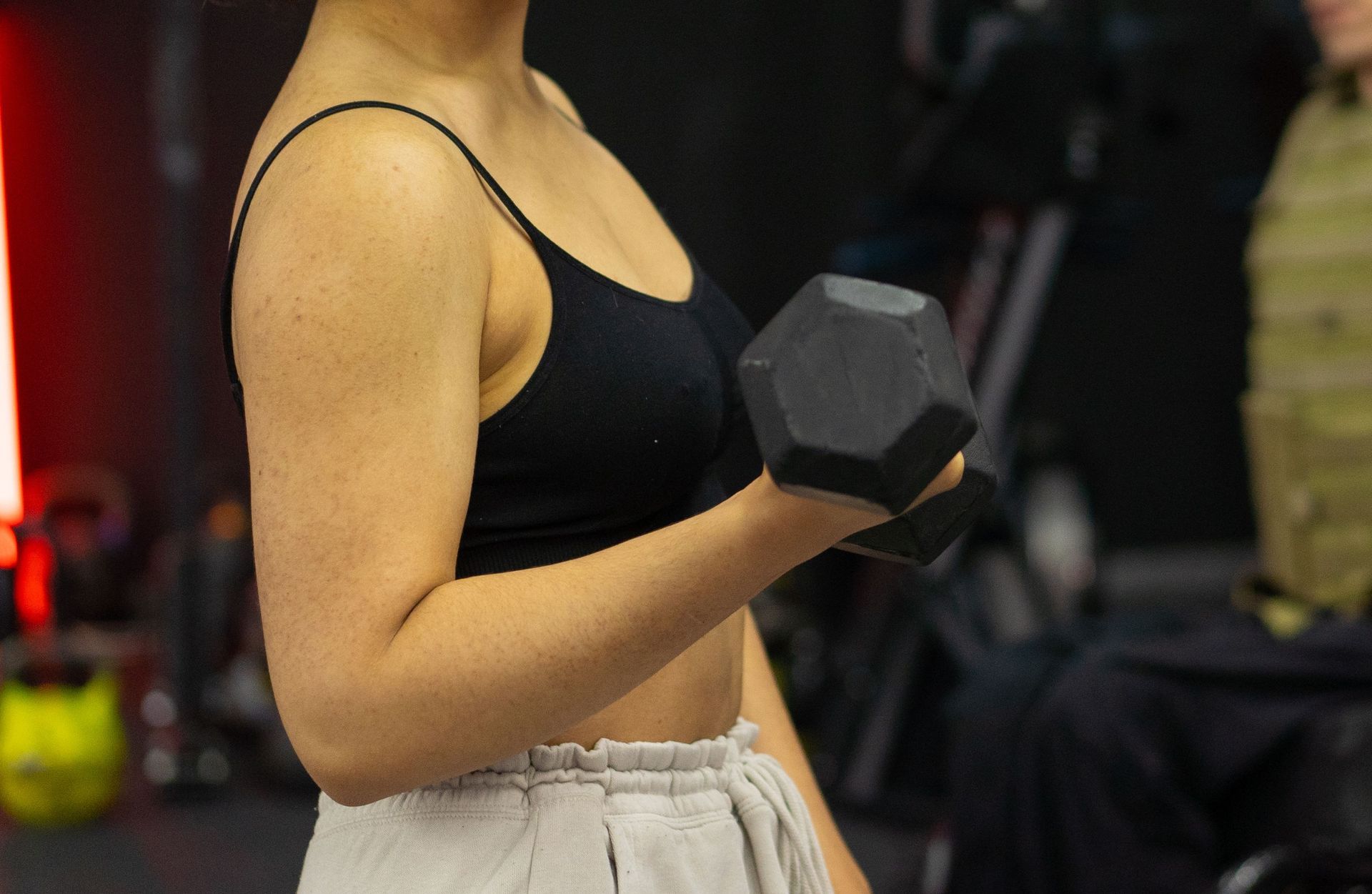 Client lifting weights and building muscle