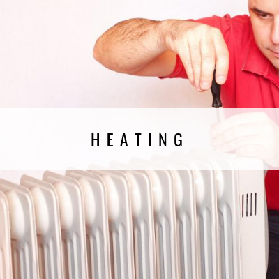 Man working on white heater, red shirt, labeled