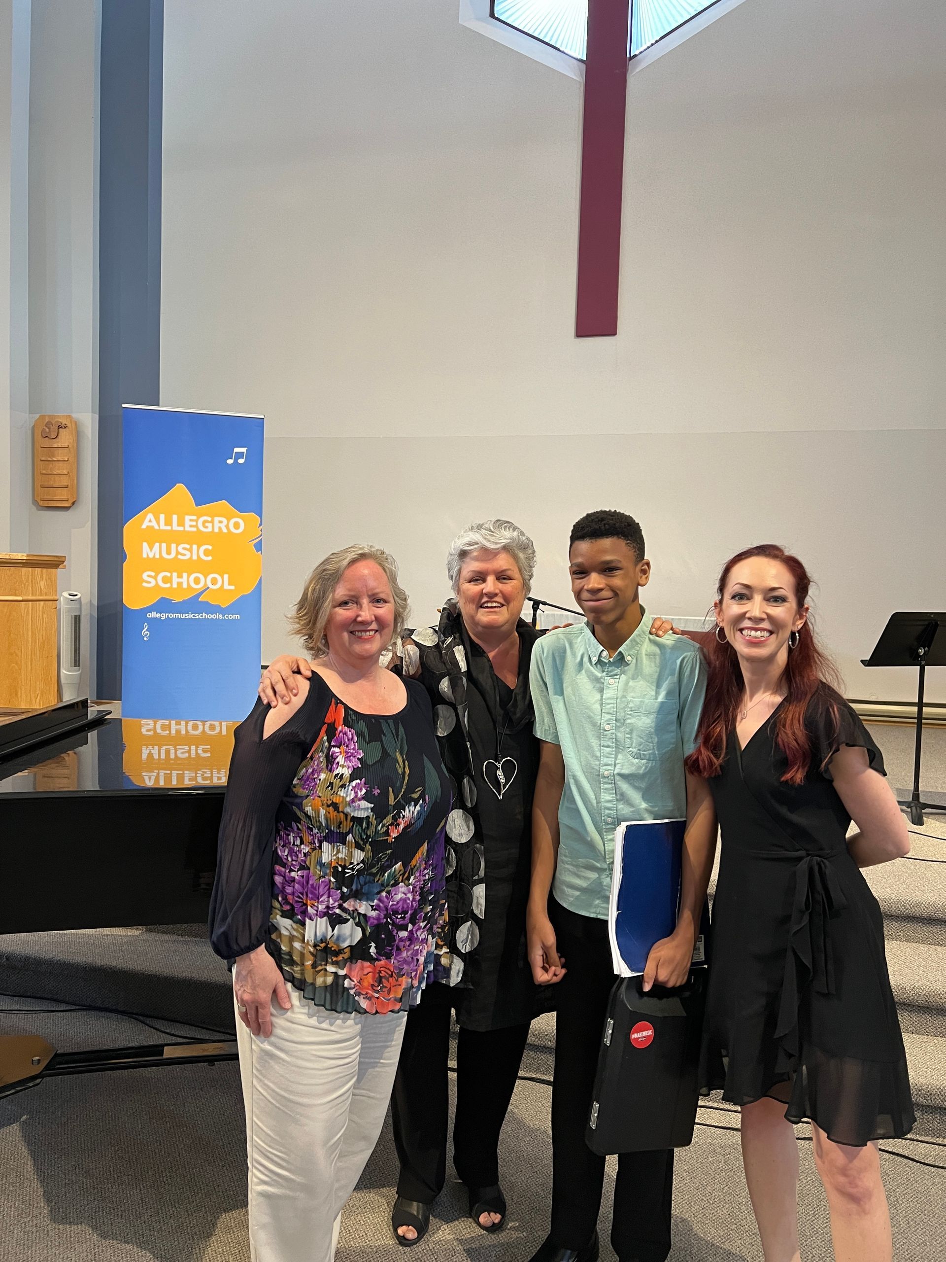 A group of people are posing for a picture in a church.