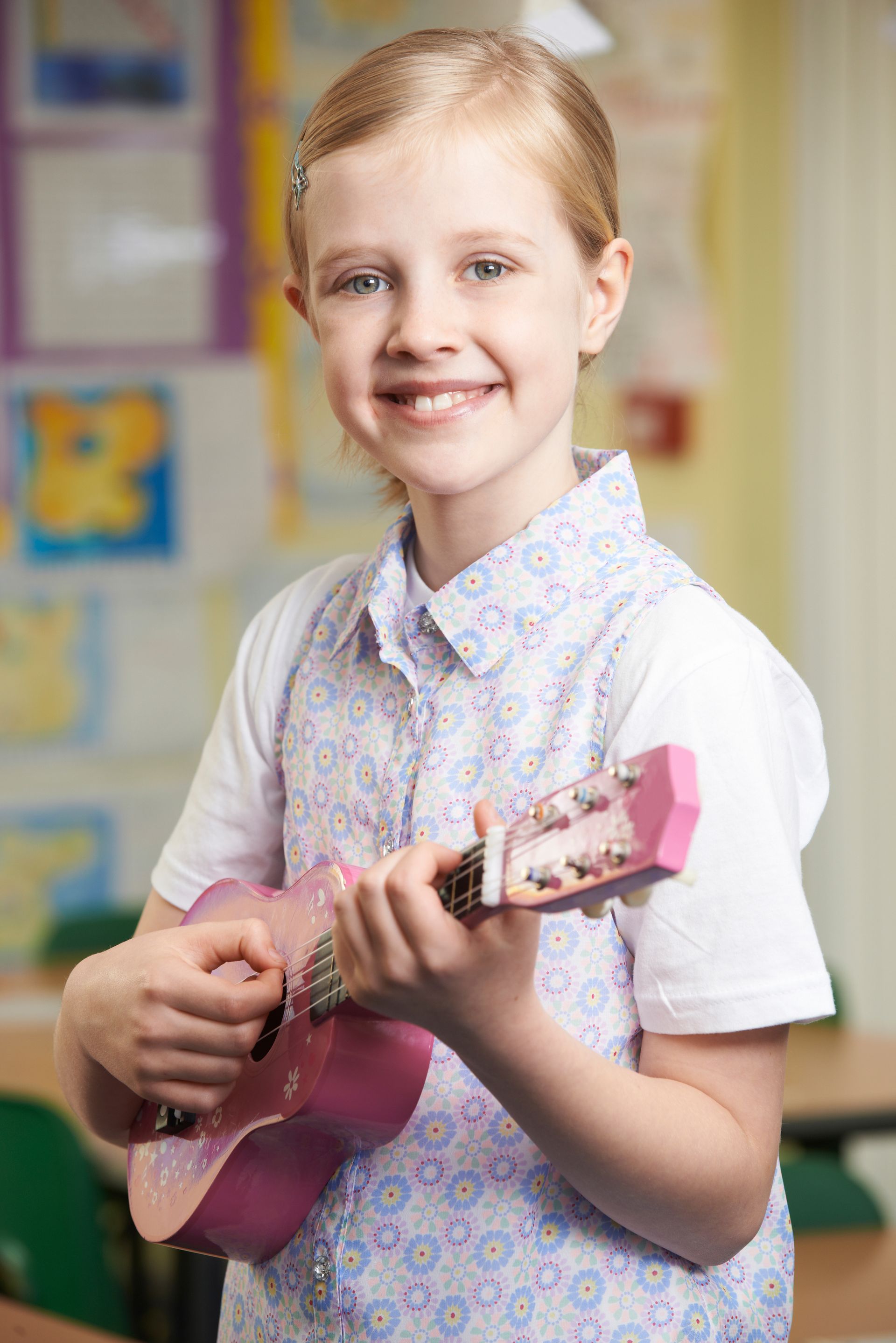 girl playing ukulele