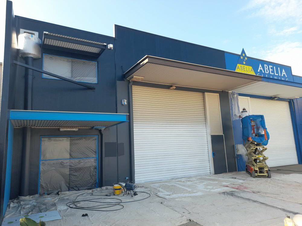 A Building With A Sign That Says Adelphia On It Is Being Painted — Kiwi Painter In Mooroobool, QLD