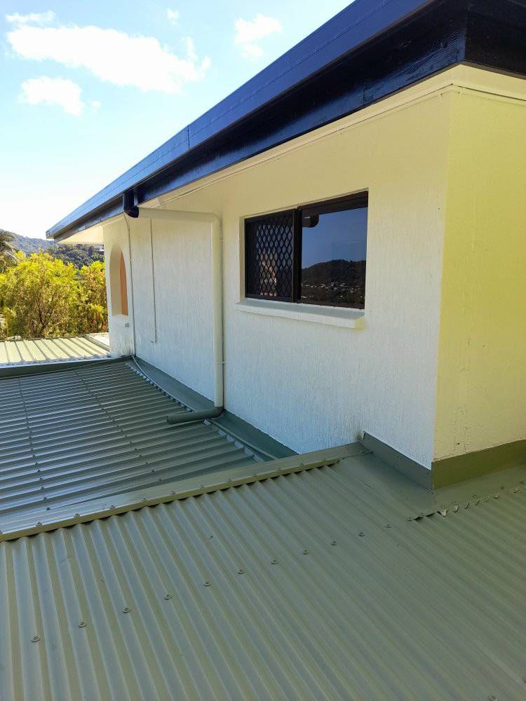 A White House With A Green Roof And A Window — Kiwi Painter In Mooroobool, QLD