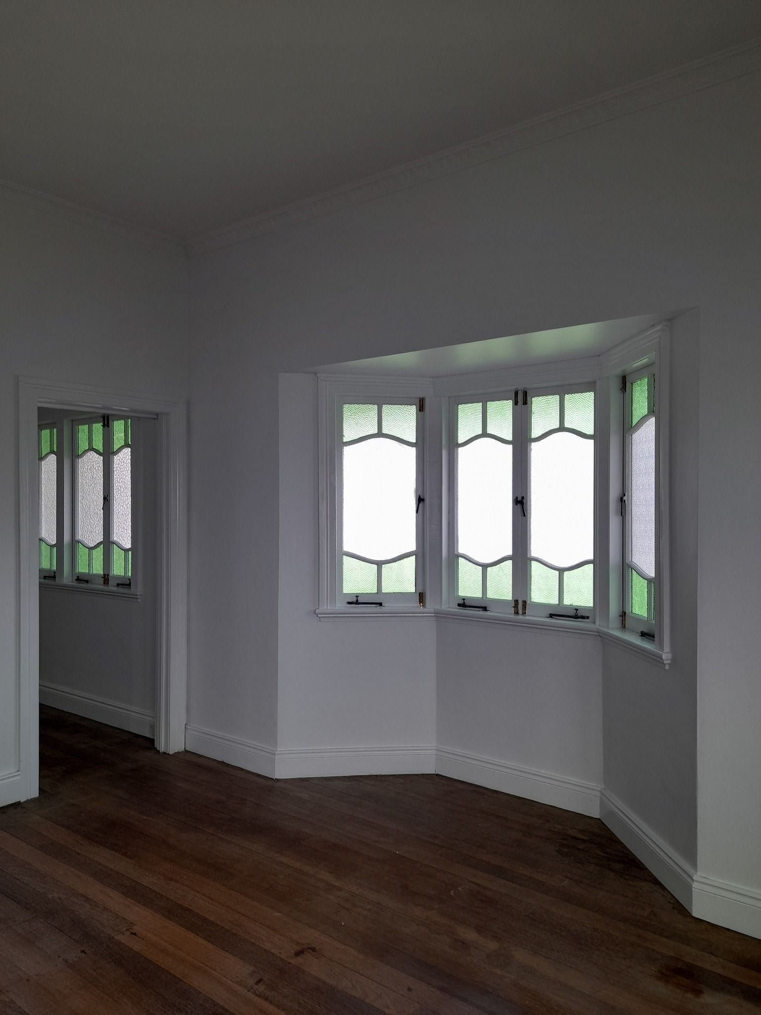 An Empty Room With A Bay Window And Stained Glass Windows — Kiwi Painter In Mooroobool, QLD